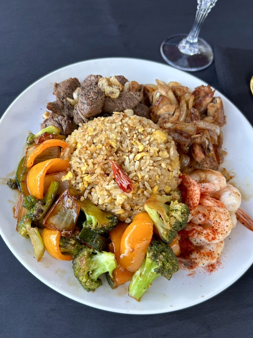 A full hibachi plate: grass-fed beef, chicken, shrimp, fried rice and stir-fried vegetables